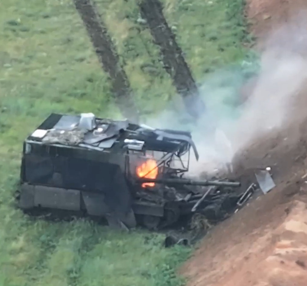 Destroyed Russian turtle tank with frontal dozer blade after UAV strike in Novopavlivka sector.