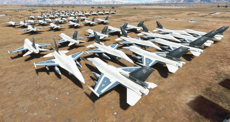 F-16 fighter jets lined up in long-term storage at an aircraft boneyard.