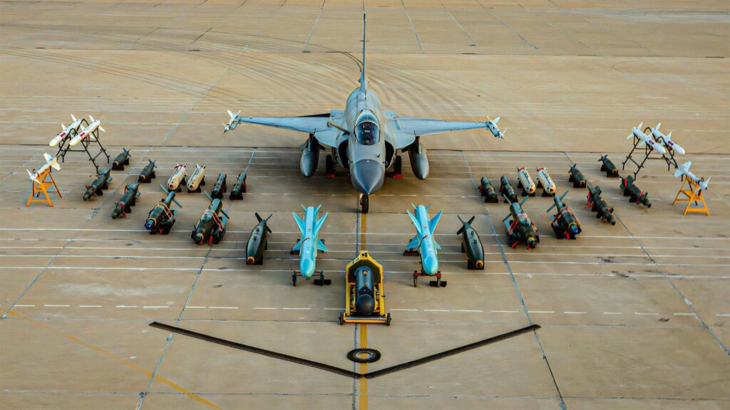 JF-17 Block III multirole fighter jet (Pakistan Air Force) on static display, loaded with long-range PL-15 AAMs, CM-400AKG anti-ship/anti-radiation missiles, and guided bombs.