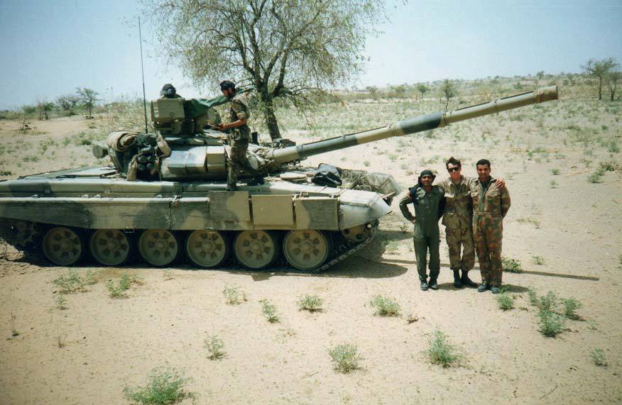 T-90S main battle tank operating in the Thar Desert during high-temperature mobility trials, moving across sandy terrain under clear desert conditions.